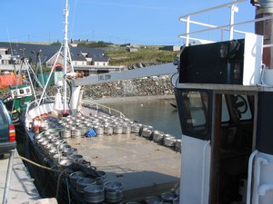 A boat bearing a burden of beerless barrels bound for Cleggan.