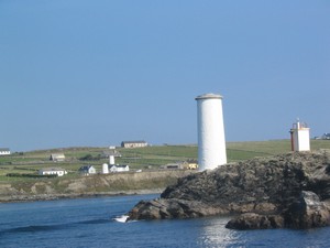 The navigation marker at the entrance to Bofin Harbour. Note two more of the same among the houses in the background. Lining up these navigation markers is important for making a safe passage into the harbour.