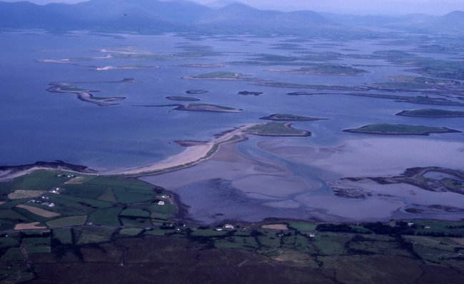 The bay and some of the islands looking north  from the side of Croagh Parrick. The long beach at stretching out to Bartraw Island can be clearly seen.