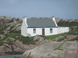 traditional house at the side of the channel from Burtonport to Arranmore - see previous photo for contrast