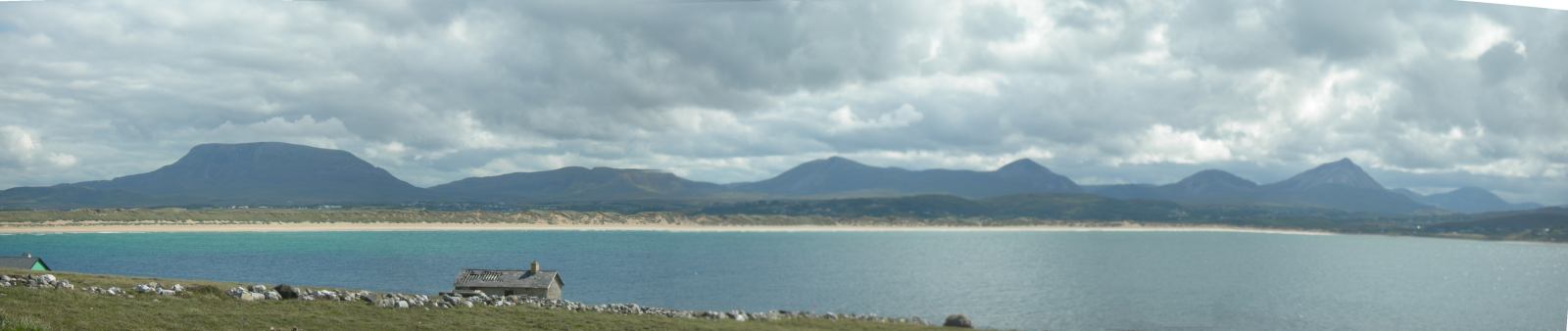 The mainland viewed from the island - from flat topped Muckish on the left to the sharp quartzite peak of Errigal on the right.