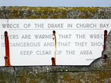 This sign is on the wall of the pier at Church Bay. - On 2 October 1917 a German U-Boat torpedoed the HMS Drake, a British Navy armoured cruiser. The damaged cruiser made its way to Church Bay and anchored but eventually capsized and sank in 18 metres of water. In November 1962 a 50 metre English fishing trawler hit the wreick and sank beside it.